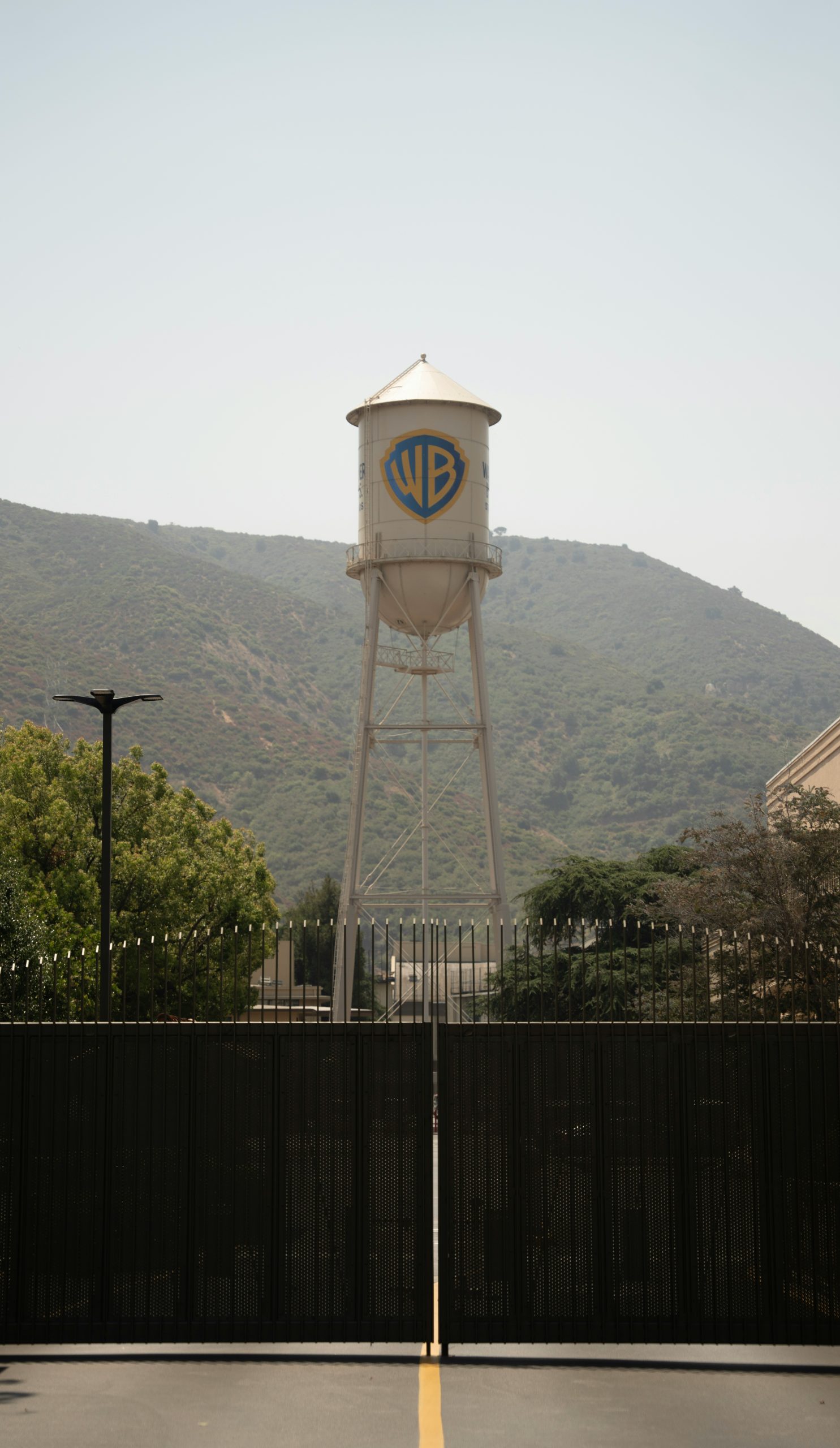 A water tower with a logo on it